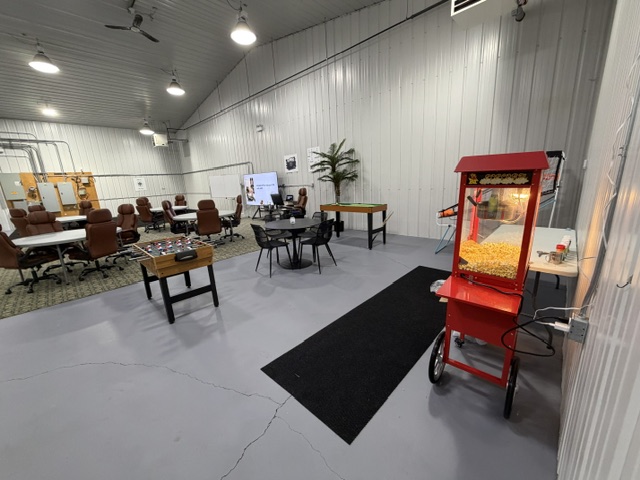 Sharalife facility overview with training classroom, student games area, and popcorn machine